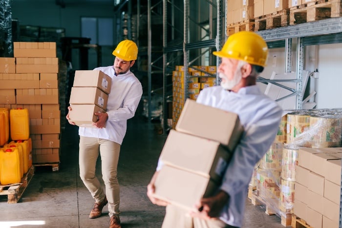 storage-workers-carrying-heavy-parcels